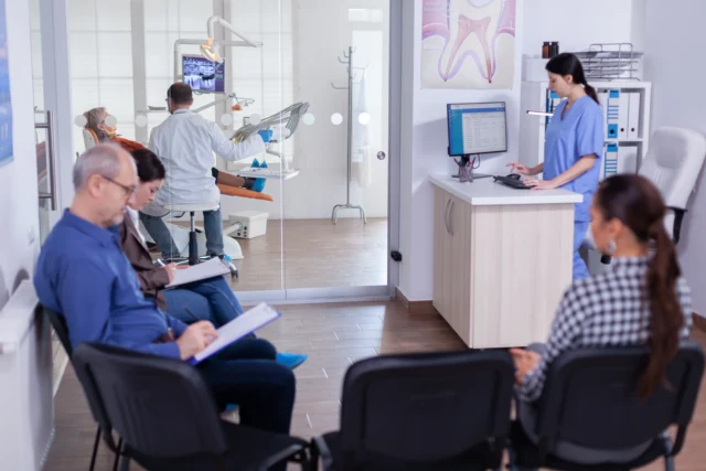 https://greenarbordental.com/wp-content/uploads/2024/12/crowded-stomatology-waiting-area-with-people-filling-form-dental-consultation-640x427.webp